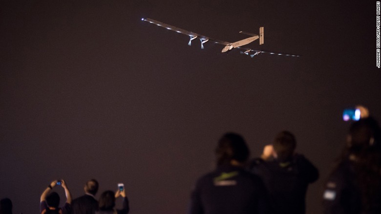 People take pictures as the Swiss-made solar-powered plane Solar Impluse 2 takes off from Nanjing&#39;s Lukou International Airport in Nanjing, China on Sunday, May 31.