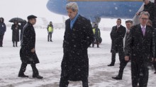 Kerry walks off the plane at Kiev Boryspil International Airport in Kiev, Ukraine, on February 5. His visit came as international pressure grew for an immediate halt to surging violence.