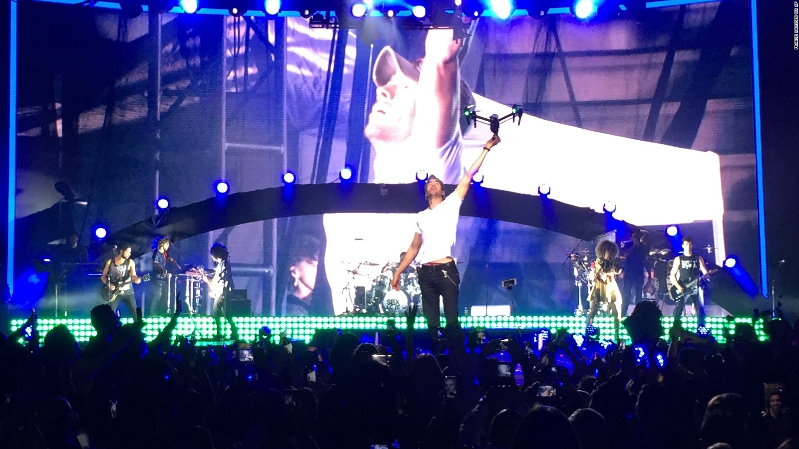 Enrique Iglesias continued his show after a drone injured his hand during a Saturday concert.