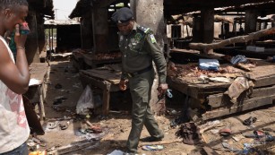 A Nigerian policeman inspects the site of a suicide attack by Boko Haram at a busy cattle market in the northeastern Nigerian city of Maiduguri in June, 2015. Boko Haram overtook ISIS as the world&#39;s deadliest terror group last year, according to the Global Terrorism Index, while Nigeria had the biggest year-on-year increase in terrorism, with deaths up more than 300%.