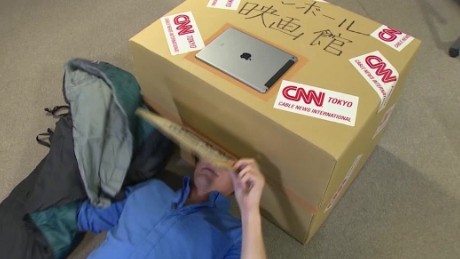 Why are these people sticking their heads in boxes?