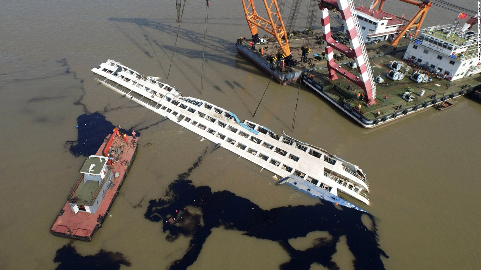 Rescuers work to hoist the ship on June 5.