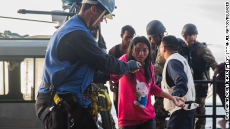 Navy rescues migrants on raft