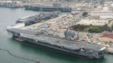 Three Nimitz-class aircraft carriers USS Carl Vinson (CVN 70), top, USS Ronald Reagan (CVN 76), center, and USS John C. Stennis (CVN 74) are pierside at Naval Air Station North Island near San Diego on June 12, 2015. The Vinson has just recently returned from a 10-month deployment. The Reagan is preparing for a move to Japan later this year and the Stennis was making a port call after steaming from its homeport of Bremerton, Washington.
