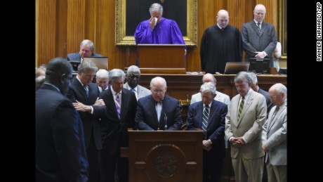 Chaplain James St. John leads senators in prayer June 18 at the statehouse in Columbia.