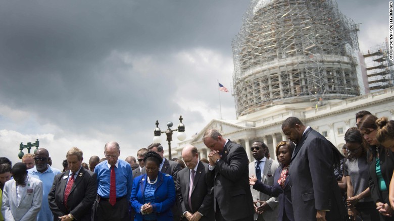 Members of the U.S. Congress gather in front of the Capitol Building in Washington on Thursday, June 18, during a moment of silence for the nine killed in a &lt;a href=&quot;http://www.cnn.com/2015/06/18/us/gallery/charleston-south-carolina-church-shooting/index.html&quot; target=&quot;_blank&quot;&gt;church shooting&lt;/a&gt; in Charleston, South Carolina.