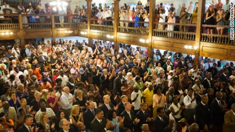 Parishioners applaud during a  memorial service on Thursday, June 18, at Morris Brown AME Church in Charleston, South Carolina. 