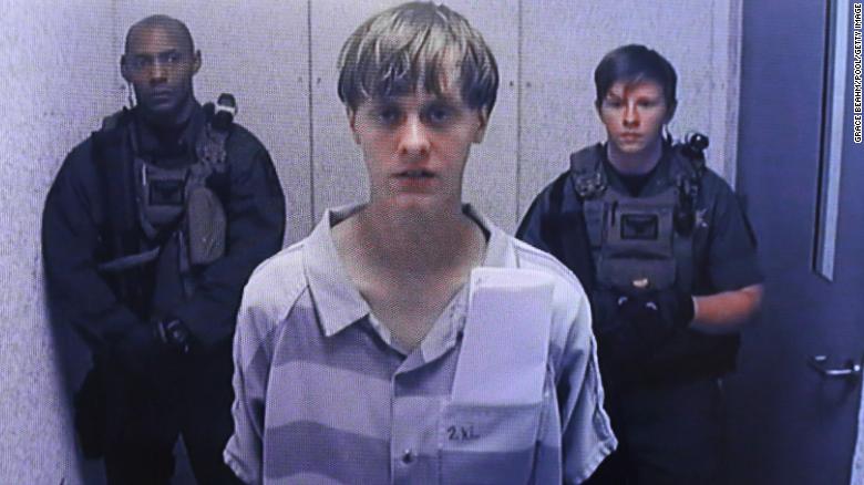 Caption:NORTH CHARLESTON, SC - JUNE 19: In this image from the video uplink from the detention center to the courtroom, Dylann Roof appears at Centralized Bond Hearing Court June 19, 2015 in North Charleston, South Carolina. Roof is charged with nine counts of murder and firearms charges in the shooting deaths at Emanuel African Methodist Episcopal Church in Charleston, South Carolina on June 17. (Photo by Grace Beahm-Pool/Getty Images)

