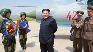 North Korean leader Kim Jong Un meets with North Korea&#39;s first female fighter jet pilots in this undated photo released by the country&#39;s state media on Monday, June 22. He called the women &quot;heroes of Korea&quot; and &quot;flowers of the sky.&quot;