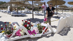 People lay flowers on the beach in front of Hotel Riu Imperial Marhaba, in the coastal city of Sousse, Tunisia, on Saturday, June 27. Gunmen <a href="http://www.cnn.com/2015/06/26/africa/tunisia-terror-attack/index.html" target="_blank">killed at least 38 people at site</a>, the same day terrorists lashed out brutally in France and bombed a mosque in Kuwait.