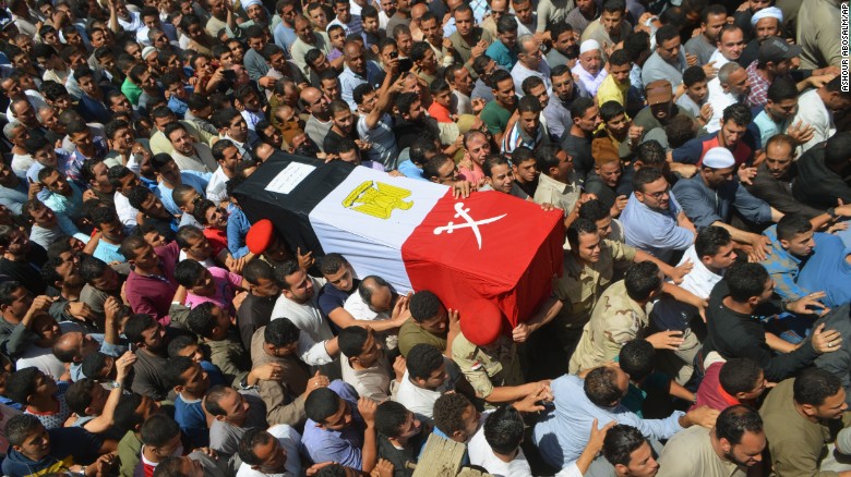 People in Ashmoun, Egypt, carry the coffin for 1st Lt. Mohammed Ashraf, who was killed when the ISIS militant group &lt;a href=&quot;http://www.cnn.com/2015/07/02/world/isis-egypt-expanding-reach/index.html&quot; target=&quot;_blank&quot;&gt;attacked Egyptian military checkpoints&lt;/a&gt; on Wednesday, July 1. At least 17 soldiers were reportedly killed, and 30 were injured.