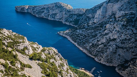 The Mediterranean seaport of Marseille is complete with Roman ruins and medieval architecture. The city's maritime economy thrives at the Old Port where fresh catches are sold each morning. Roads and cycling paths line along the coves and sandy beaches to offer visitors and locals a spectacular scenic route.