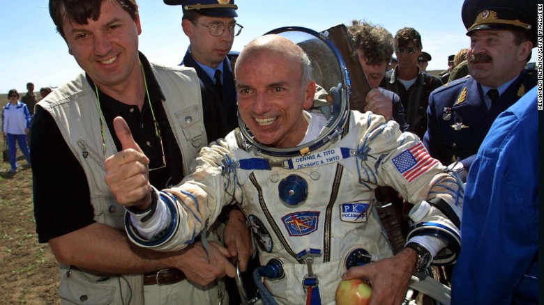 The world&#39;s first space tourist, Dennis Tito, celebrates after landing near the Kazakh town of Arkalyk in 2001. 