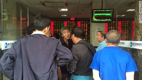 Postmortem: Elderly investors trade opinions on the stock markets at a brokerage house in downtown Shanghai after another major sell-off on Wednesday. 