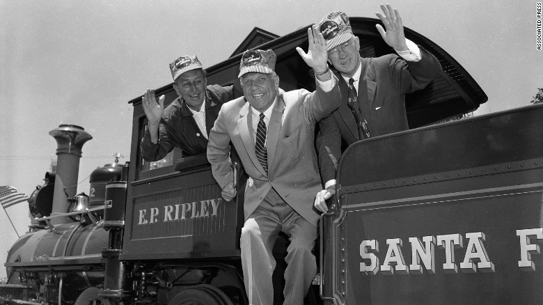 Disney, left, was a devoted fan of model railroads and trains. Here he&#39;s shown with California Gov. Goodwin J. Knight, center, and Fred G. Gurley, president of Santa Fe Railroad, right, on board the cab of an old-time railroad engine getting ready to take a ride around the park. The Santa Fe Railroad was an investor in the park.