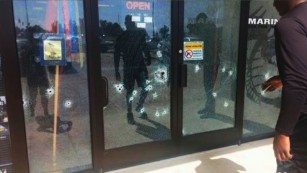 April Grimmett says she took this photo showing damage to glass at the military recruiting center on Lee Highway in Chattanooga.