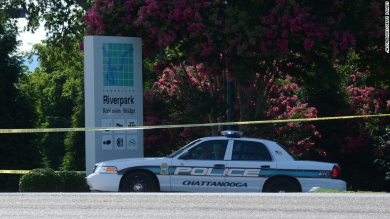 A police car blocks the entrances to the Navy reserve center in Chattanooga, Tennessee, on Thursday, July 16. Authorities say Mohammad Youssuf Abdulazeez, 24, opened fire first on a military recruiting station at a strip mall and then moved to an operational support center operated by the U.S. Navy seven miles away, where he killed four U.S. Marines. The gunman was also killed. 