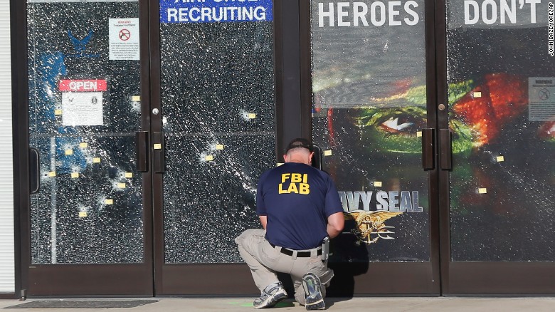 An FBI investigator works outside a military recruiting center where a gunman opened fire Thursday, July 16, in Chattanooga, Tennessee. Authorities say Mohammad Youssuf Abdulazeez, 24, opened fire first on the recruiting station and then moved to a U.S. Navy facility seven miles away. At the Navy facility, he fatally shot four U.S. Marines and wounded three other people before he died in police gunfire.