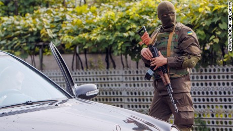 Ukrainian security forces on the lookout in Bobrovyshche on July 14. The country's troops face daily attacks from Russian-backed separatists despite a ceasefire being in place.