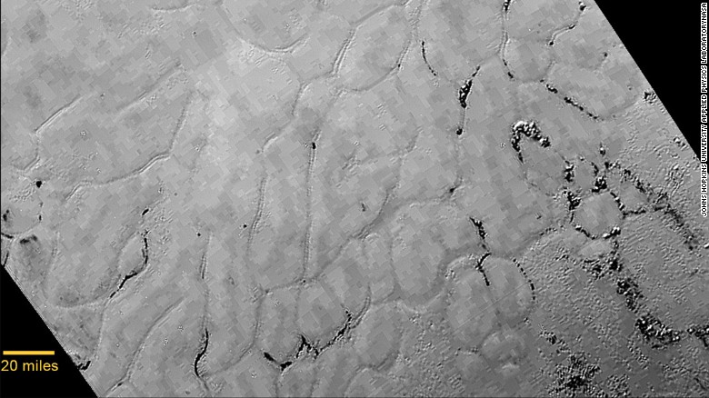 Images taken of Pluto&#39;s heart-shaped feature, informally named &quot;Tombaugh Regio,&quot; reveal a &quot;vast, craterless plain that appears to be no more than 100 million years old,&quot; NASA said on Friday, July 17. The frozen region &quot;is possibly still being shaped by geologic processes.&quot; NASA&#39;s New Horizons spacecraft was launched in 2006 and traveled 3 billion miles to the dwarf planet.
