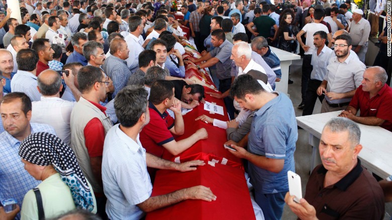 Turks mourn over coffins during a funeral for Suruc attack victims. 