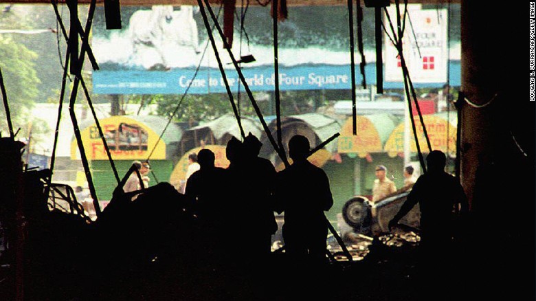 In this photograph taken 13 March 1993, Indian officials inspect bomb damage in the basement of the Air India building, one of a series of bombs that killed 257. 