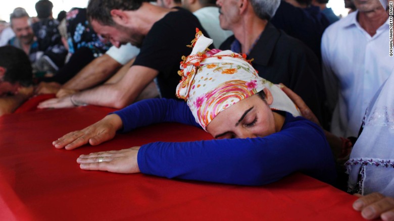 Turkish mourners grieve over a coffin during a funeral ceremony in Gaziantep on Tuesday, July 21, for the victims of a suspected ISIS suicide bomb attack. &lt;a href=&quot;http://www.cnn.com/2015/07/20/world/turkey-suruc-explosion/&quot;&gt;That bombing killed at least 31 people&lt;/a&gt; Monday, July 20, in Suruc, a Turkish town that borders Syria. Turkish authorities have blamed the terror group for the attack.