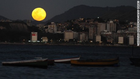 The full moon rises over Rio de Janeiro on August 31, 2012. According to NASA, this is the second time in August that a full moon is seen - the first was on August 1 to 2. This phenomenon, which is referred to as the 'blue moon', happens every two and a half years on average. AFP PHOTO/VANDERLEI ALMEIDA (Photo credit should read VANDERLEI ALMEIDA/AFP/Getty Images)