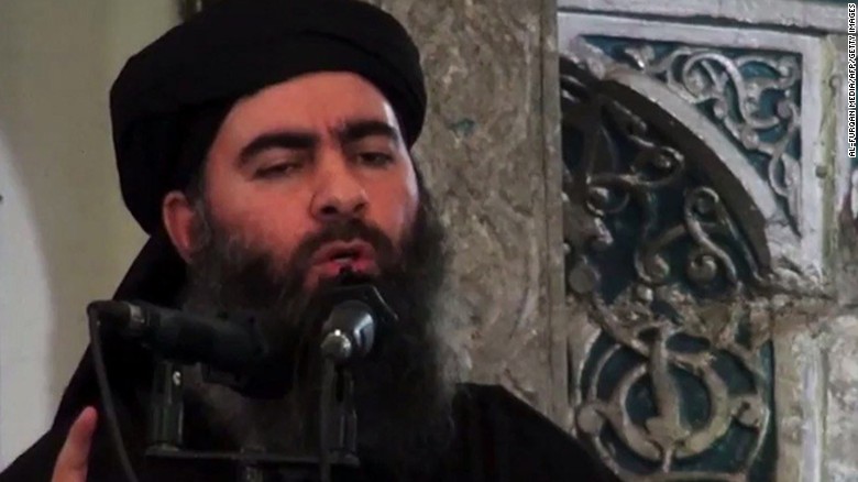 An image grab taken from a propaganda video released on July 5, 2014 by Al-Furqan Media allegedly shows the leader of the Islamic State (IS) jihadist group Abu Bakr al-Baghdadi, aka Caliph Ibrahim, adressing Muslim worshippers at a mosque in the militant-held northern Iraqi city of Mosul. Baghdadi, the self-proclaimed caliph of the brutal jihadist Islamic State (IS) group that has seized large chunks of Iraq and Syria, made the AFP shortlist of most influential people of 2014. AFP PHOTO / HO / AL-FURQAN MEDIA 