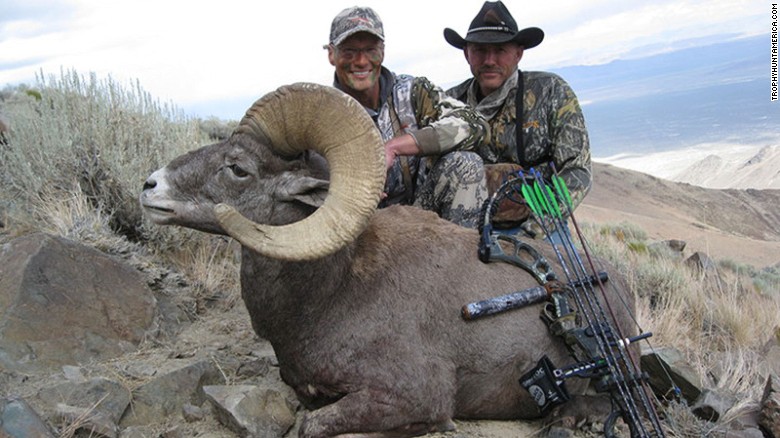 Walter J. Palmer, left, a U.S. hunter wanted in the killing of Zimbabwe's Cecil the lion, poses with a dead ram.