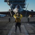 PACIFIC OCEAN (Nov. 4, 2014) An F-35C Lightning II carrier variant joint strike fighter is prepared for launch aboard the aircraft carrier USS Nimitz (CVN 68). The F-35 Lightning II is undergoing initial at-sea trials aboard Nimitz. (U.S. Navy video by Mass Communication Specialist 1st Class Brett Cote/Released) 