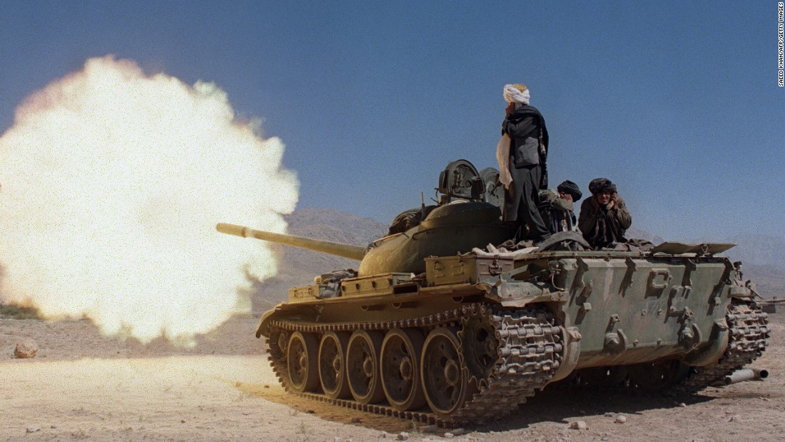 Taliban soldiers in Russian-made tanks fire on the forces of former Afghan defense minister Ahmad Shah Massood in October 1996