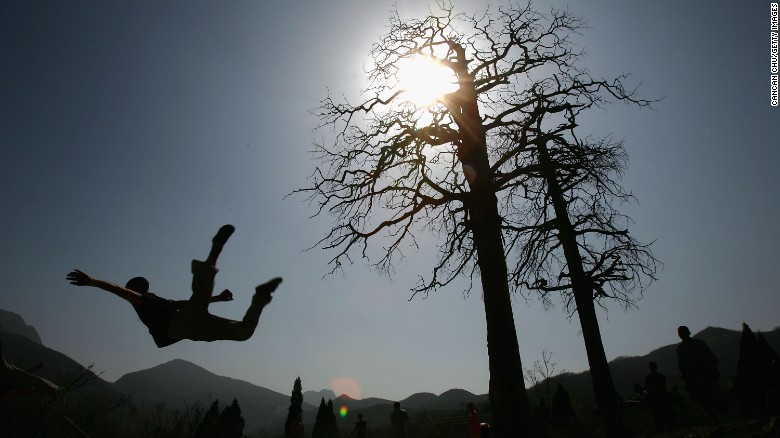 Warrior monks of Shaolin practice Kung Fu skills during a training session at the temple in 2005.