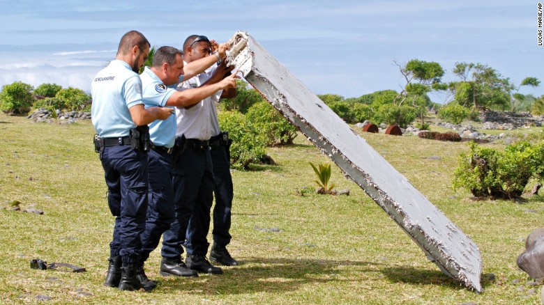 Police officers inspect debris on July 29.