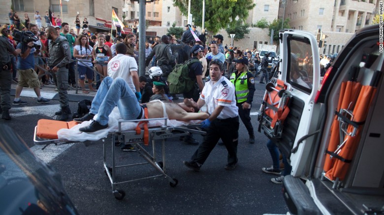A wounded person receives treatment during Thursday's gay parade in Jerusalem.