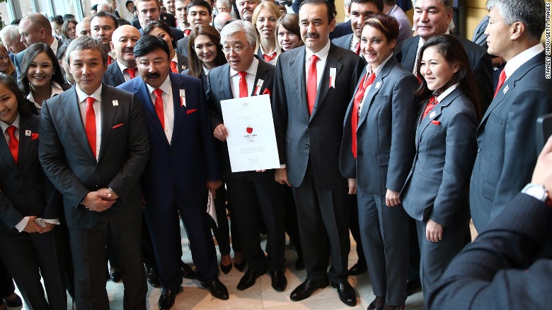 Kazakhstan&#39;s Prime Minister, Minister of Foreign Affairs, and President of the National Olympic Committee are pictured with bid committee members presenting their bid.