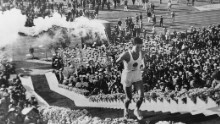 The lighting of the torch was particularly poignant as Yoshinori Sakai -- born in Hiroshima on August 6, 1945, the day an atomic bomb was dropped on the Japanese city -- ignited the cauldron.