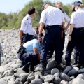 Caption:Police officers inspect metallic debris found on a beach in Saint-Denis on the French Reunion Island in the Indian Ocean on August 2, 2015, close to where a Boeing 777 wing part believed to belong to missing flight MH370 washed up last week. A piece of metal was found on La Reunion island, where a Boeing 777 wing part believed to belong to missing flight MH370 washed up last week, said a source close to the investigation. Investigators on the Indian Ocean island took the debris into evidence as part of their probe into the fate of Malaysia Airlines flight MH370, however nothing indicated the piece of metal came from an airplane, the source said. AFP PHOTO / RICHARD BOUHET (Photo credit should read RICHARD BOUHET/AFP/Getty Images)