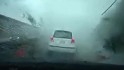 Watch a typhoon blow this car away