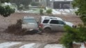 Woman trapped in car as flood rises