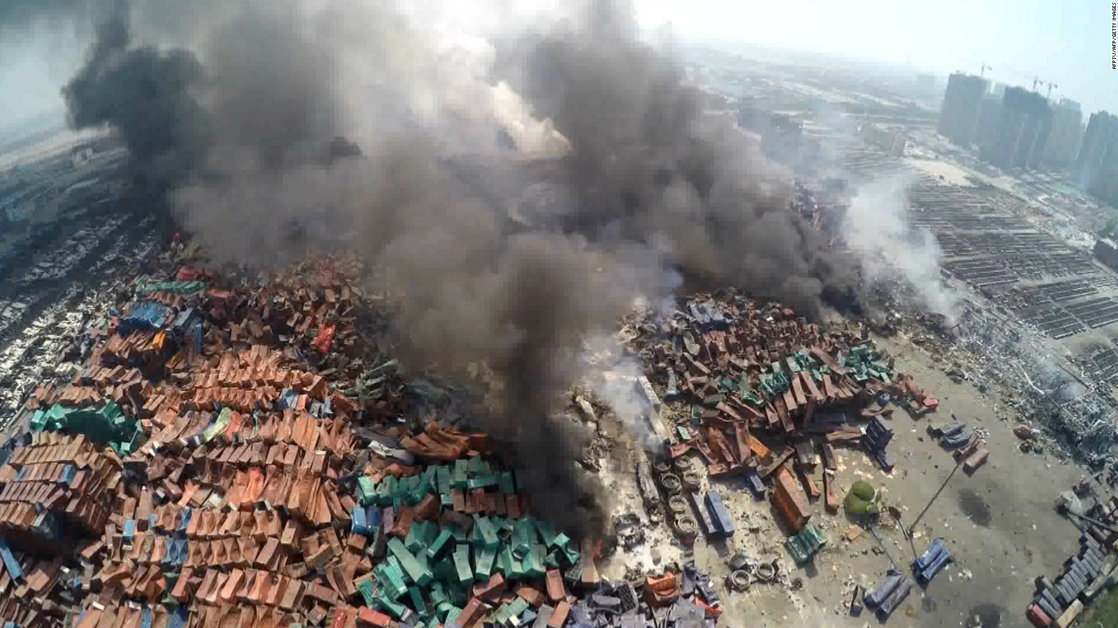 his screen grab taken from AFPTV shows an aerial image taken on August 13, 2015 of smoke rising from debris the day after a series of explosions hit a chemical warehouse in the city of Tianjin, in northern China. A Chinese military team of nuclear and chemical experts began work on August 14 at the site of two massive explosions in the city of Tianjin, state media said, as pressure grows for authorities to explain the cause of blasts that left 50 dead. CHINA OUT AFP PHOTO / AFPTVAFPTV/AFP/Getty Images