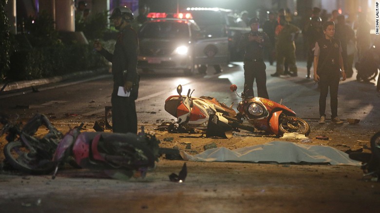 Motorcycles and debris lie on the pavement after an explosion in Bangkok, Thailand, killed at least 22 people. 