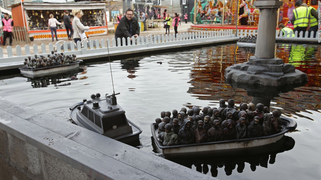 Not every piece was quite so whimsical. This more topical installation -- one of the many games at the amusement park -- makes a powerful statement about the ongoing migrant crisis. 