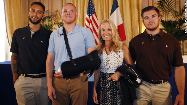 Anthony Sadler, from left, Spencer Stone, U.S. Ambassador to France Jane Hartley and Alek Skarlatos. 