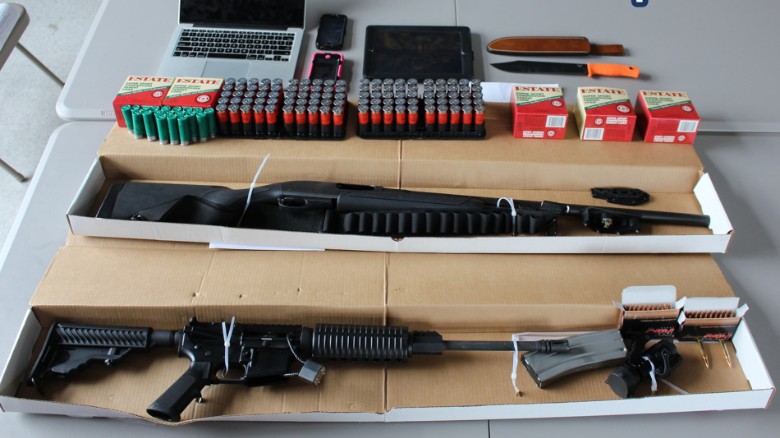 Boston police said they uncovered a 12-gauge Remington shotgun, one DPM5 model AR-15 rifle, rounds of ammunition and a hunting knife in a vehicle driven to Boston by two Iowa men who were charged following social media threats made to attendees of the Pokémon World Championships. The men were arrested on Saturday, August 22, 2015. Courtesy of Boston PD