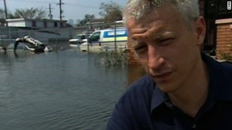 CNN's Anderson Cooper, covering Hurricane Katrina in New Orleans in 2005, reports on seeing a body on top of a car a week after the storm.