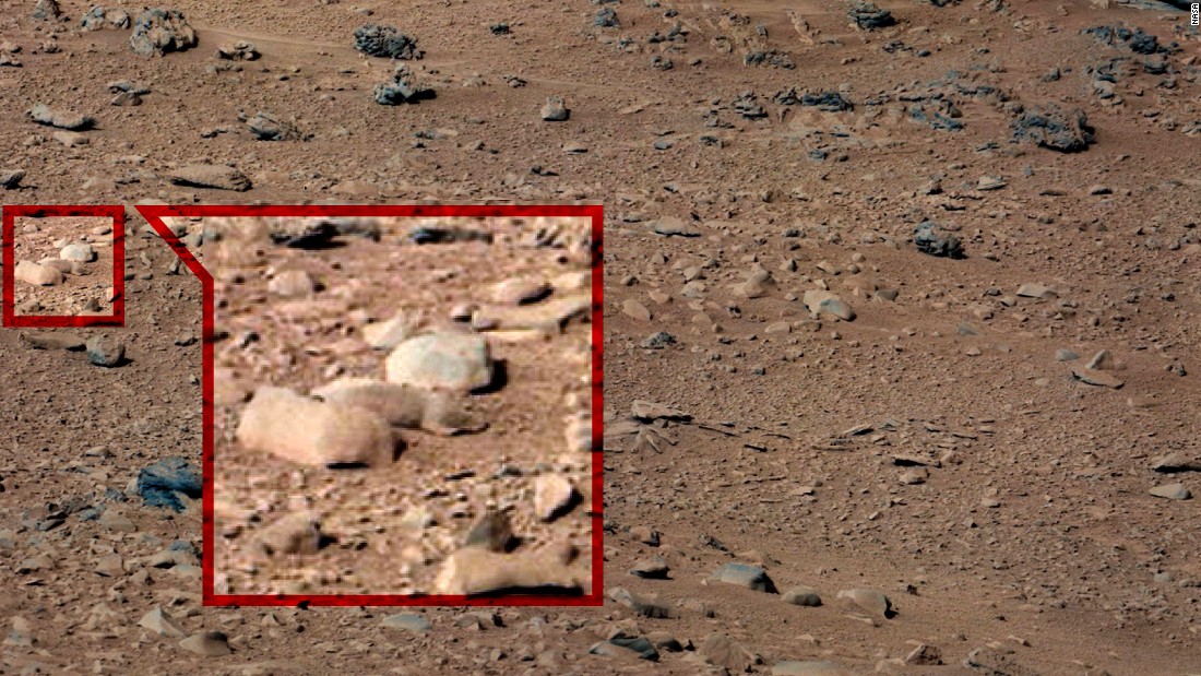  Observers spotted a squirrel crouched between two rocks in this Curiosity photo. NASA says rodents would be &quot;further up the food chain&quot; than Martian life, if it existed, ever made it to.