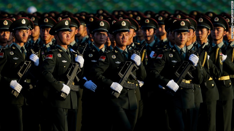 People&#39;s Liberation Army troops arrive at Tiananmen Gate in formation for the parade on September 3.
