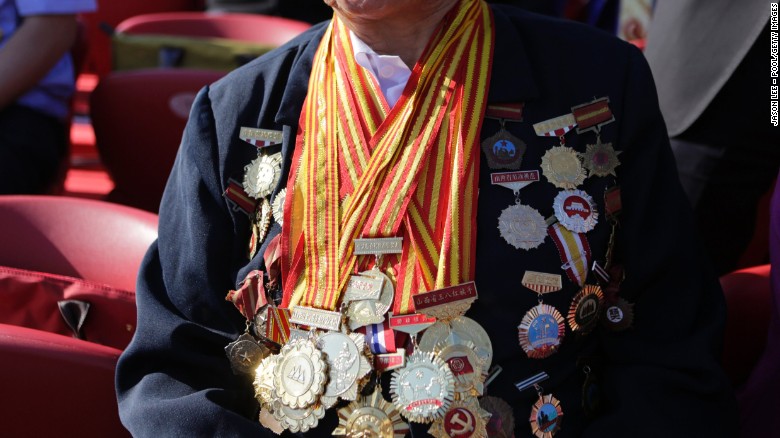 Decorated with medals, 85-year-old Shen Ji-lan prepares for the military parade in Beijing. She is the only person in China to be appointed twelve consecutive times as a member of the National People&#39;s Congress, China&#39;s legislature, according to local media.