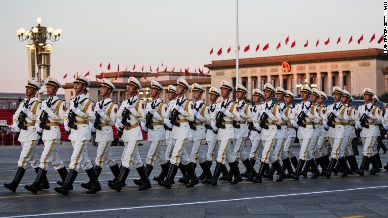 Chinese soldiers march past the Great Hall of the People in Tiananmen Square on September 3 in Beijing, China.